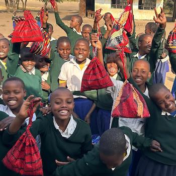 SAG Kit Distribution image showing Nyorit Primary School girls receiving 85 kits in Nyorit, Tanzania on July 17, 2026