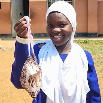 SAG Kit Distribution image showing Bukasa UMEA Primary School girls receiving 96 kits in Katikamu, Uganda on Aug 4, 2026