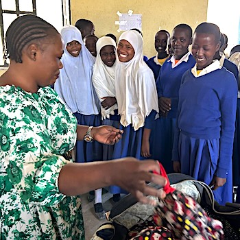 SAG Kit Distribution image showing Kimelok-Kimotoro Primary School girls receiving 84 kits in Kimelok, Tanzania on Aug 10, 2026