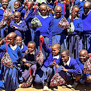 SAG Kit Distribution image showing Oltepeleki Primary School girls receiving 65 kits in Oltepeleki, Tanzania on Aug 12, 2026