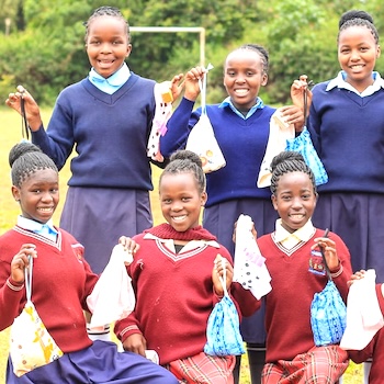 SAG Kit Distribution image showing Kiburia Primary School girls receiving 220 kits in Kianyaga, Kenya on Sept 3, 2026